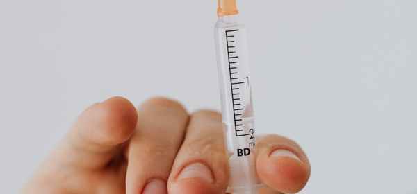 close up view of person holding a vaccine